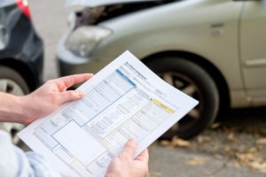 An insurance adjuster at the scene of an accident