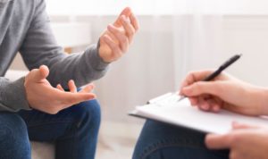 Men talking with therapist
