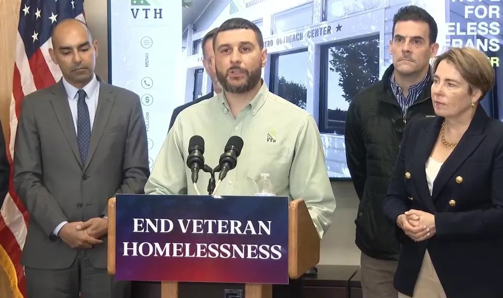 Brian sharing personal recovery story at homeless event with the governor